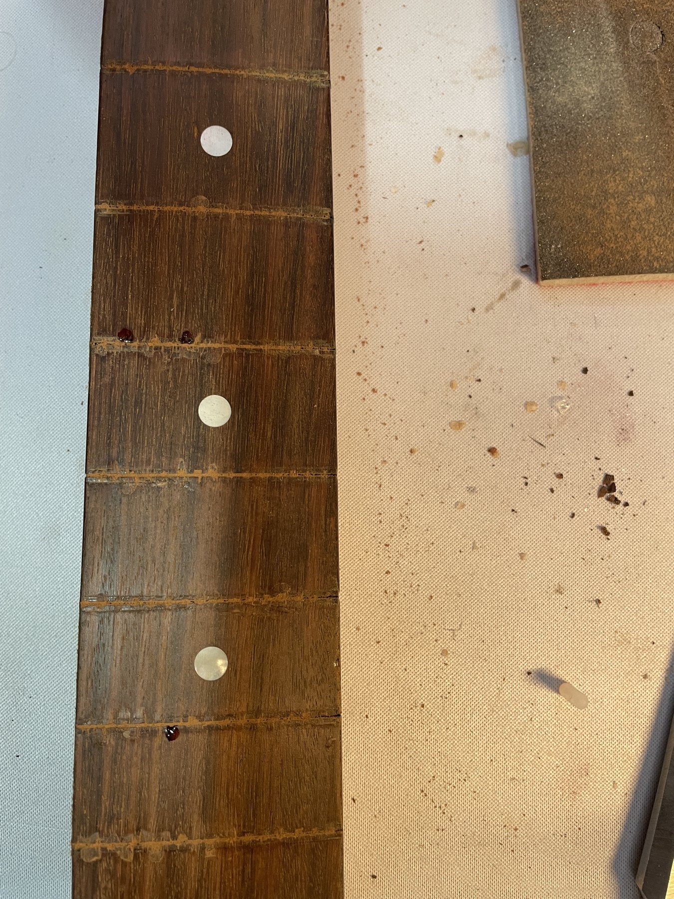 Localized fingerboard chip repairs after fret removal