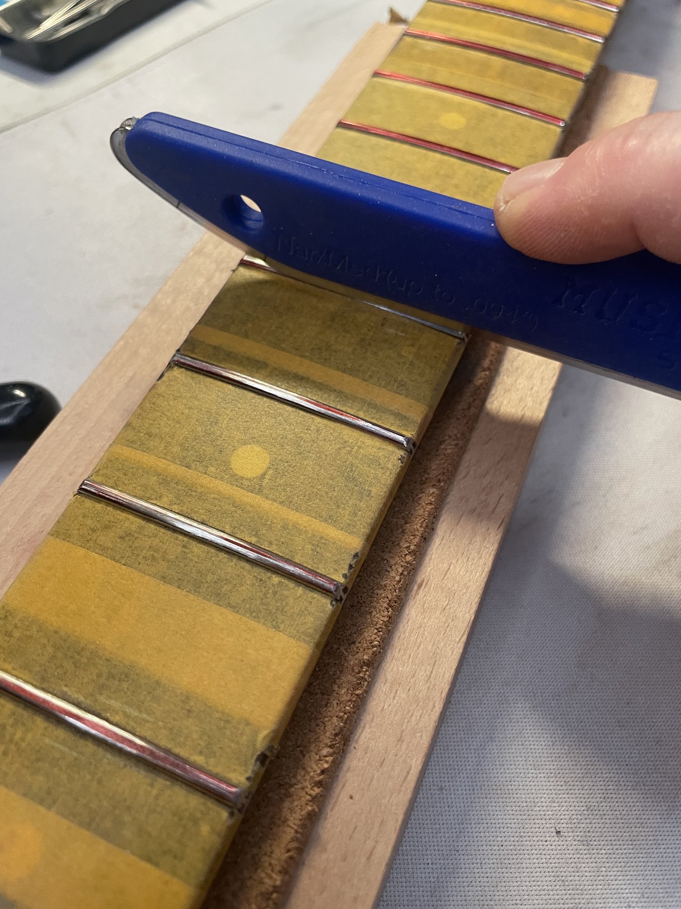 Crowning the leveled Jescar frets with the MusicNomad crowning tool