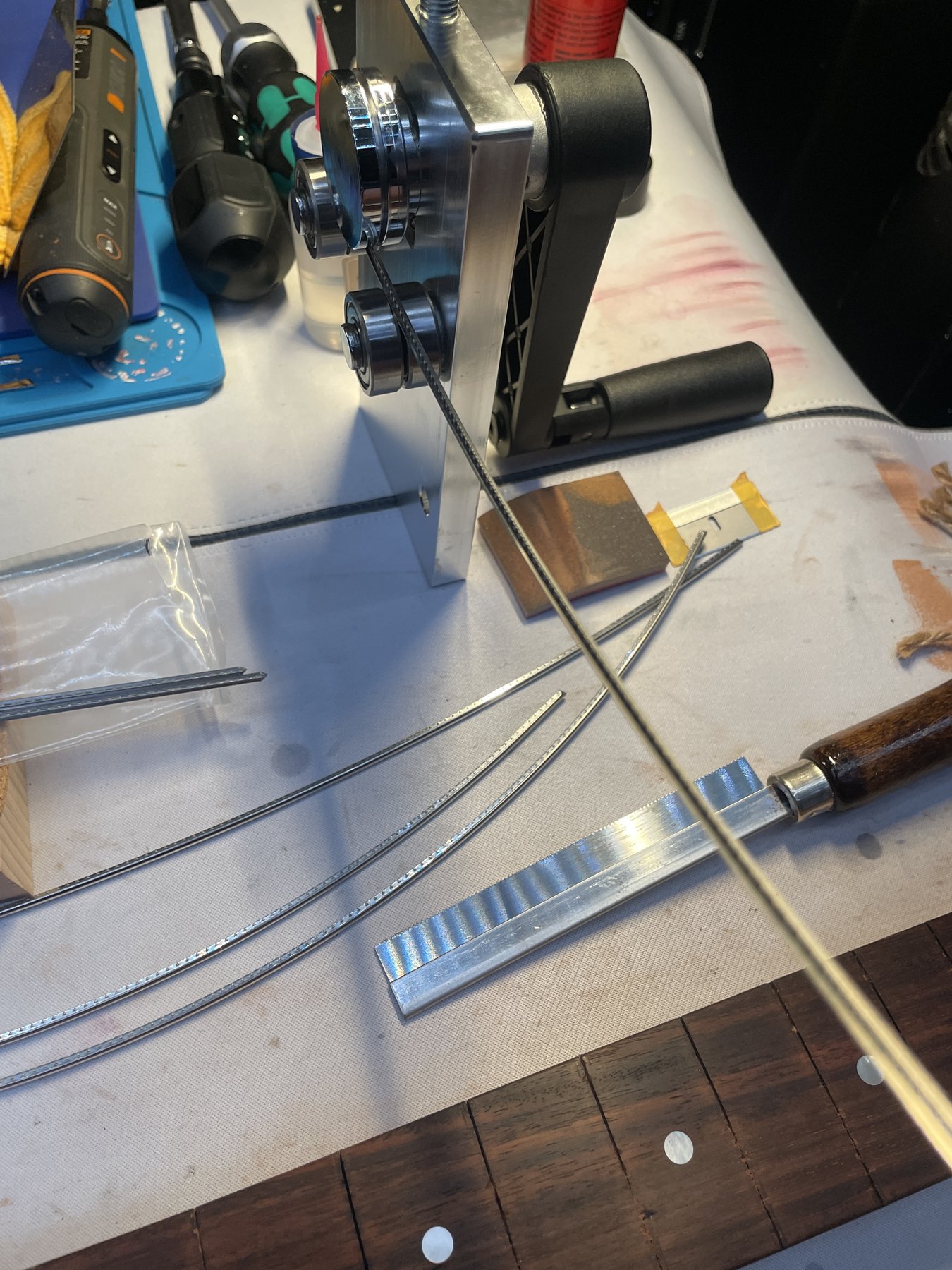 Jescar FW47104 fretwire formed for the compound-radius fingerboard